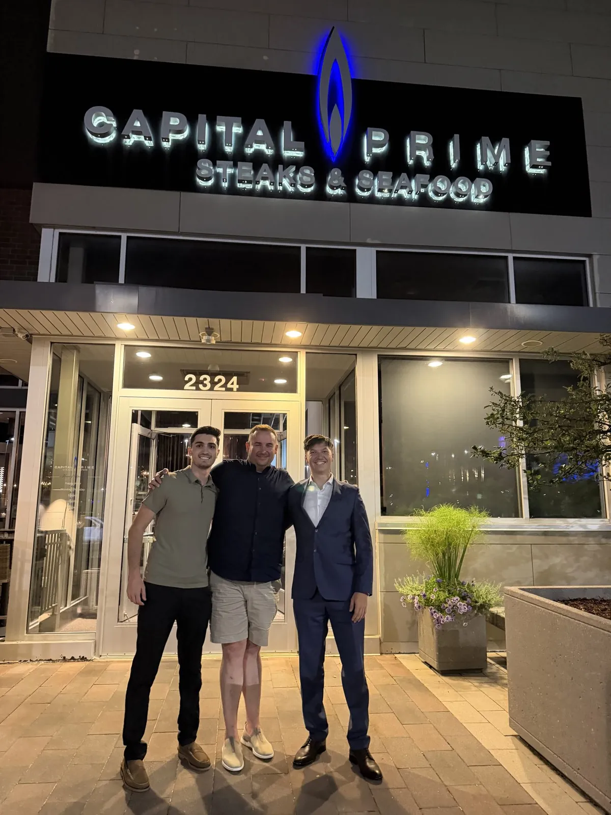 Nick and Ethan of Modern Apex with Daniel Benson outside Capital Prime