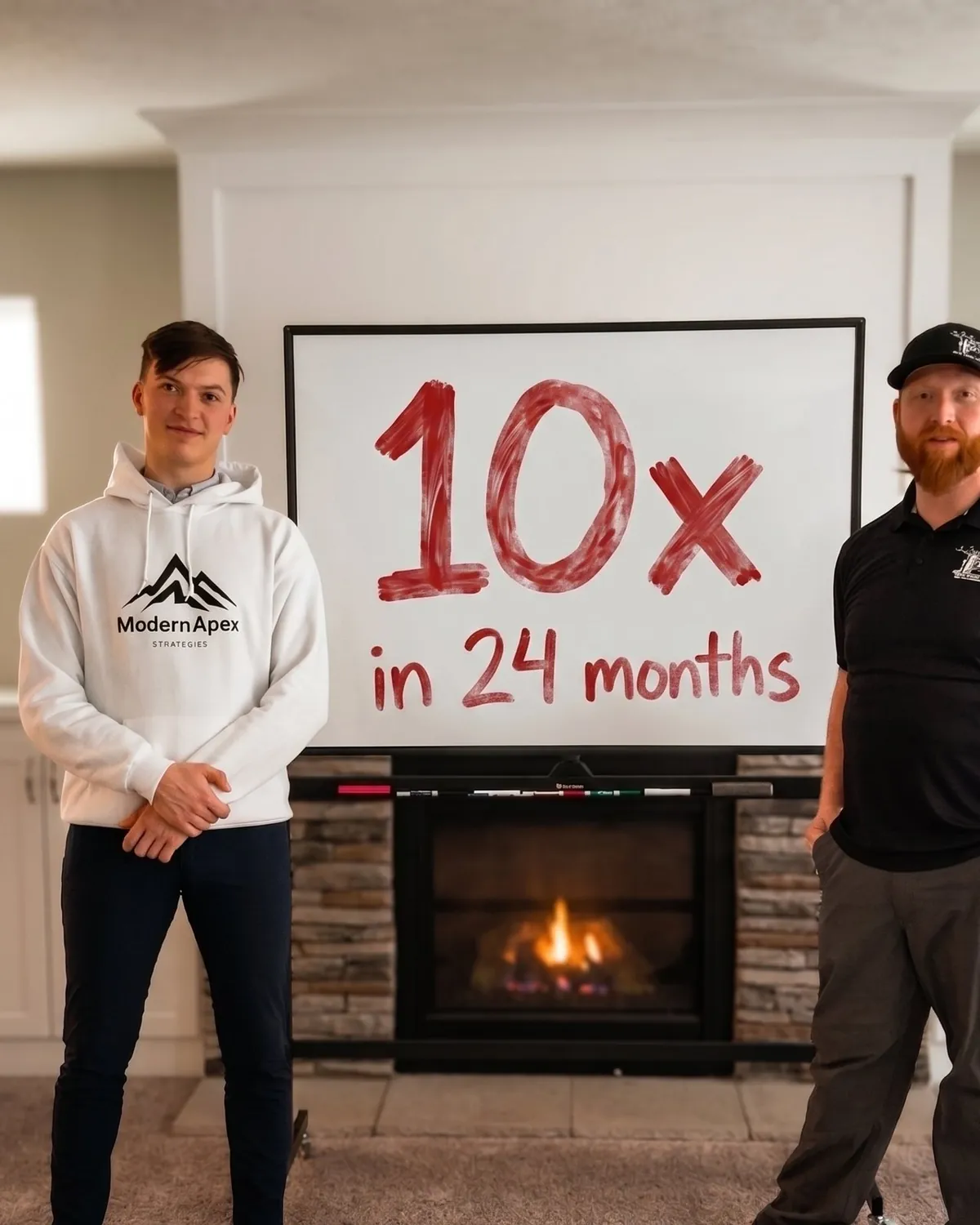 Nick and Chris standing in front of a whiteboard reading 10x in 24 months for Ole Man RB's Tree Service