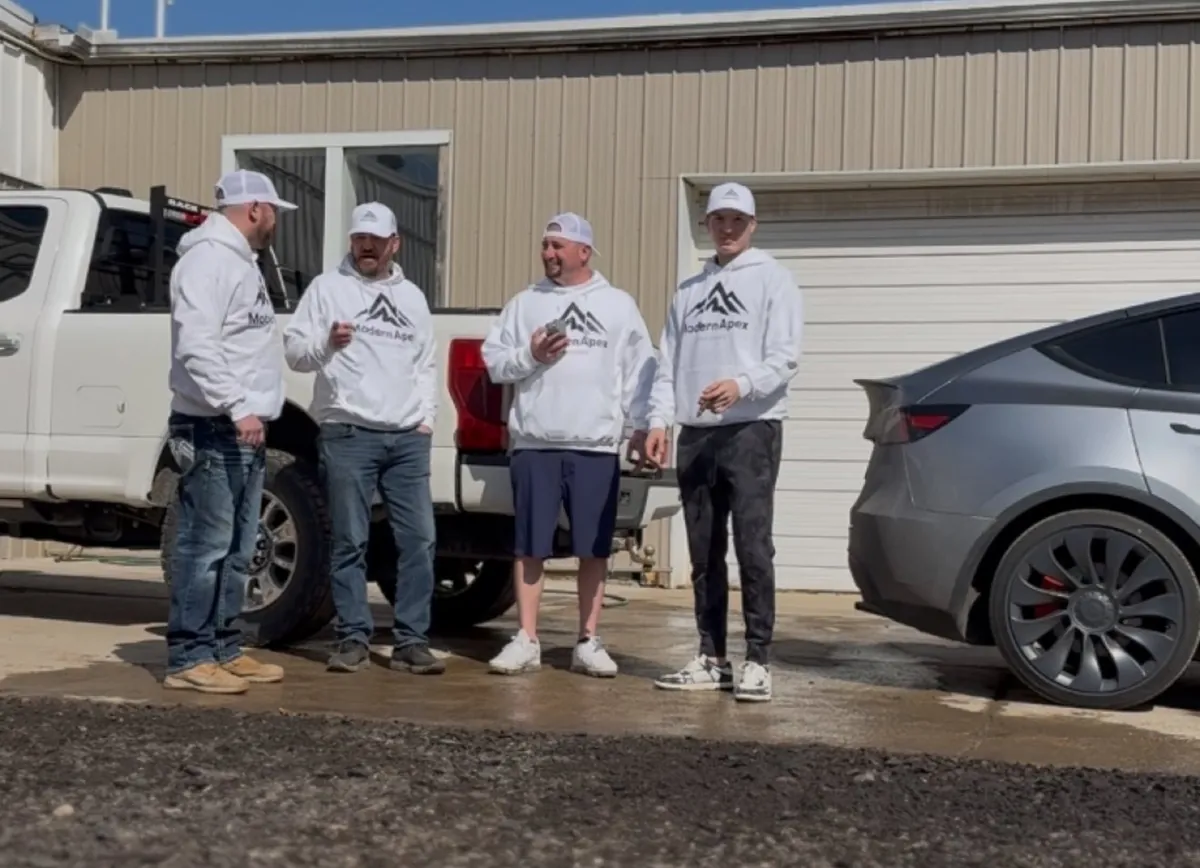 Nick with the Nelligan's Lawn & Landscape crew, all wearing Modern Apex shirts