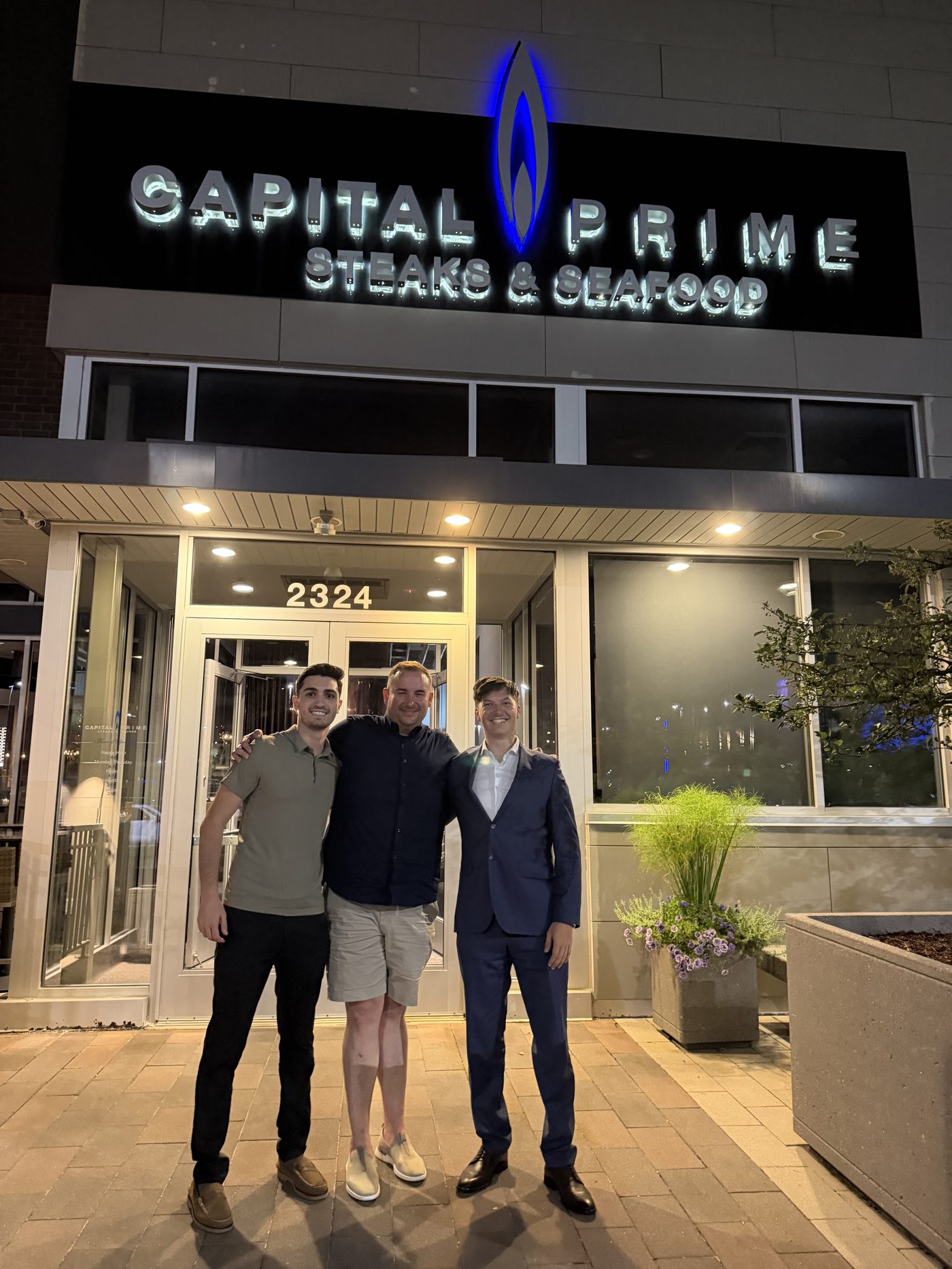 Nick with Daniel Benson of Michigan Trust and Estate and an associate outside Capital Prime, celebrating early results