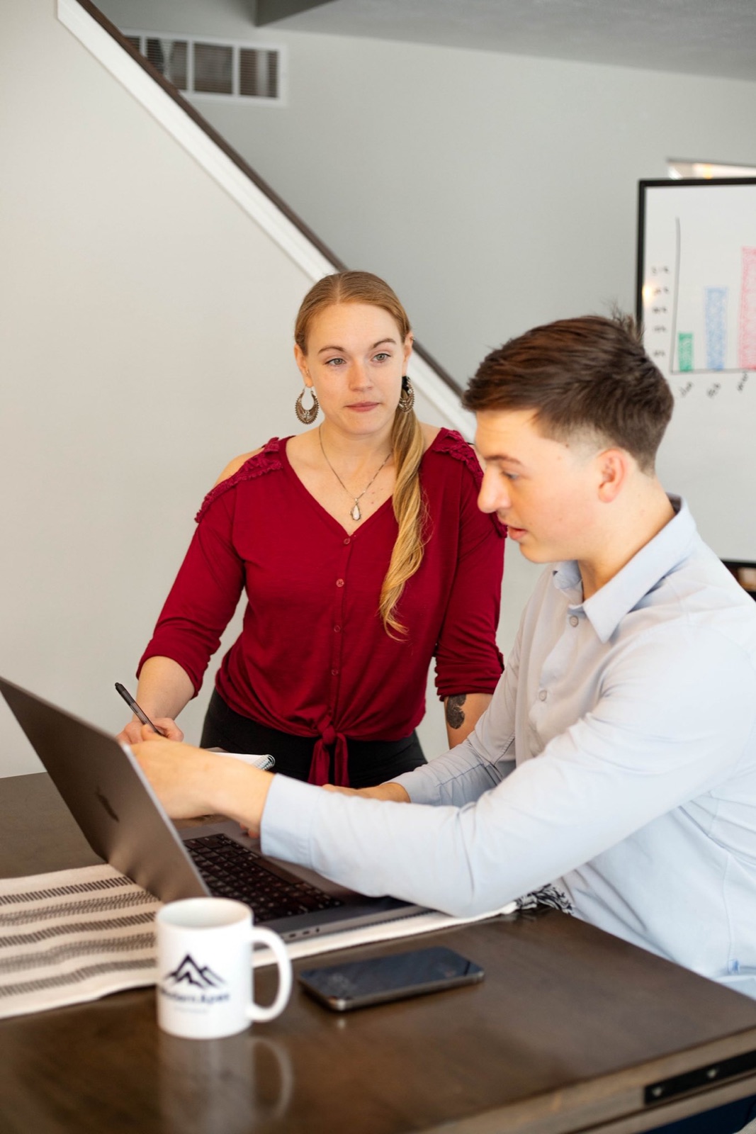 Nick and Emilia reviewing campaign performance on a laptop together